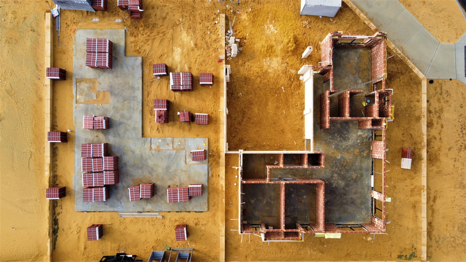 an aerial view of a construction site with tables and chairs